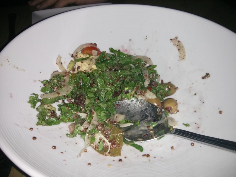 Half-eaten quinoa and kale